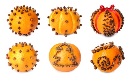 Image of Set with different pomander balls made of fresh tangerines and cloves on white background