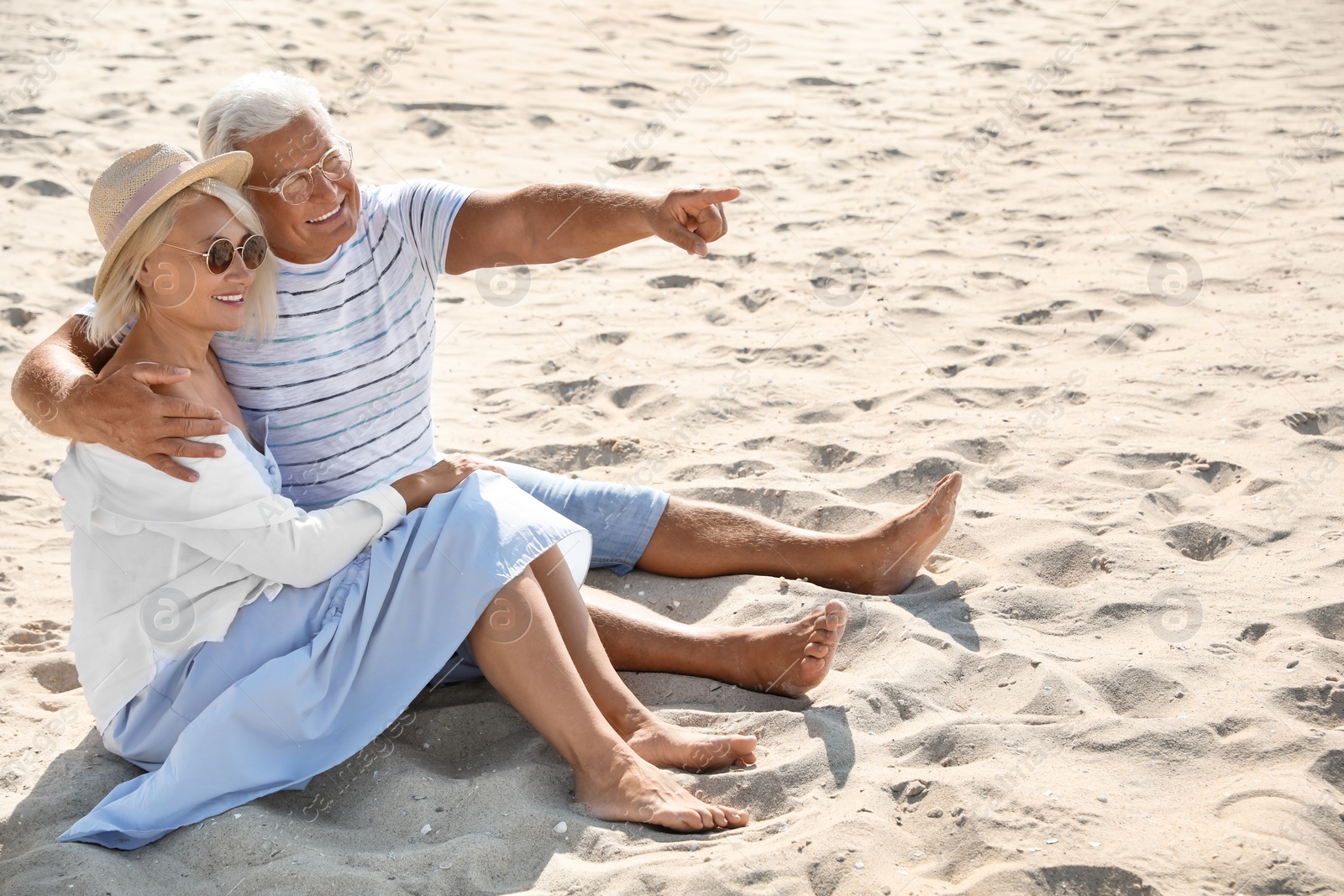 Photo of Mature couple spending time together on sea beach