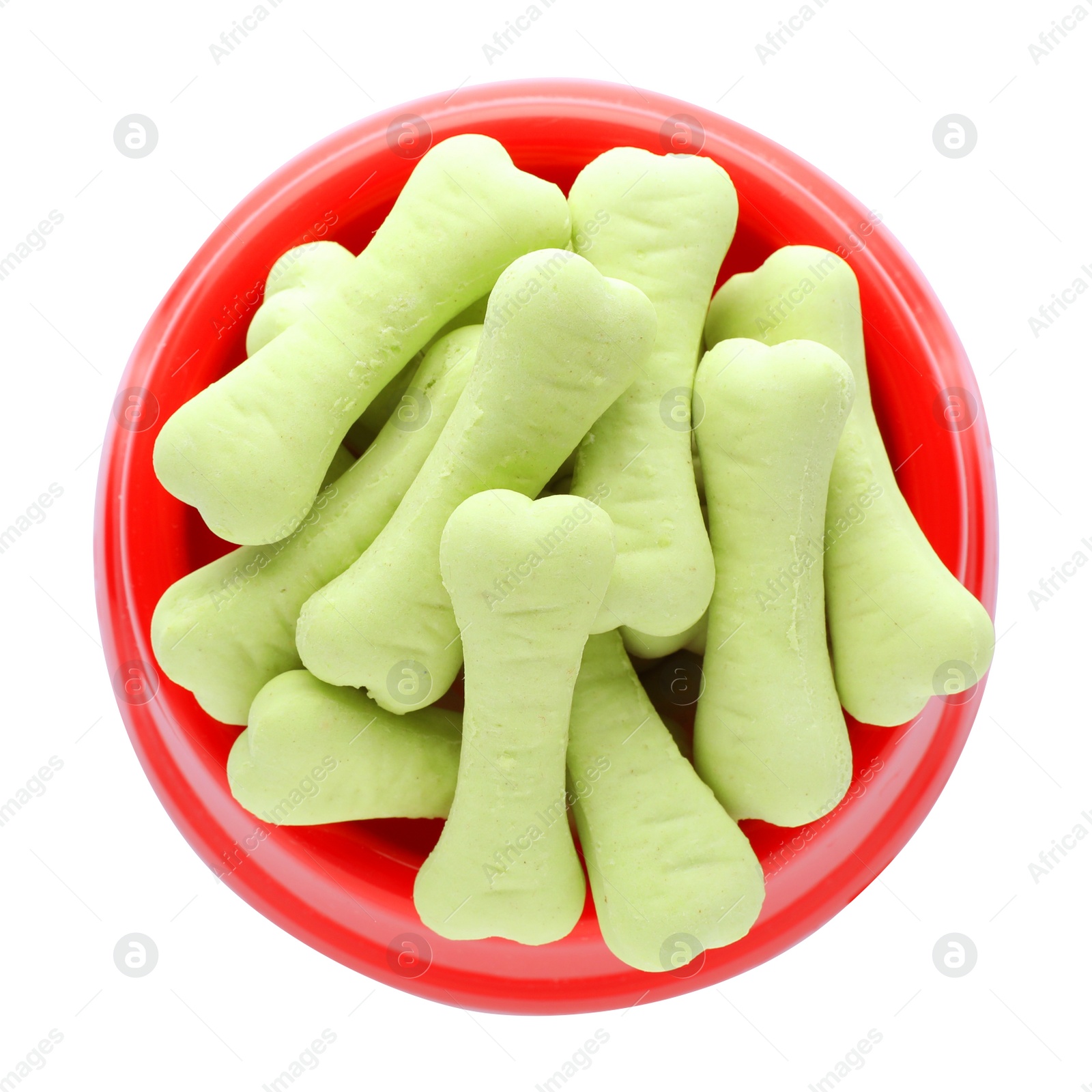 Photo of Bone shaped dog cookies in feeding bowl isolated on white, top view