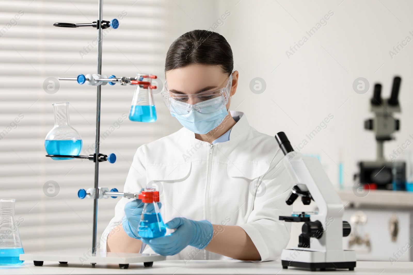 Photo of Young scientist working with samples in laboratory