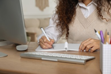 Photo of African American woman studying at home, closeup. Distance learning