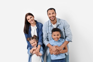 Happy international family with children on white background
