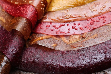 Photo of Delicious fruit leather as background, closeup view