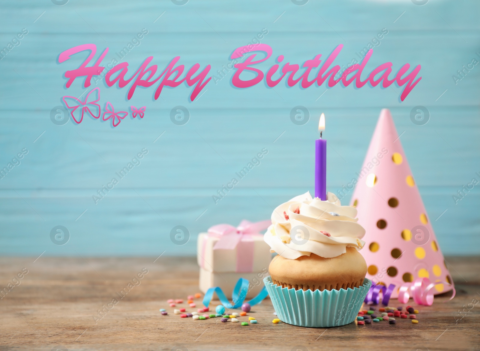 Image of Text Happy Birthday, party items and delicious cupcake with candle on light blue background