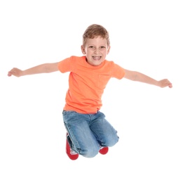 Photo of Happy little boy in casual outfit jumping on white background