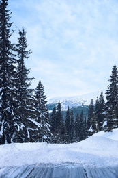 Image of Wooden surface and beautiful view of winter landscape 