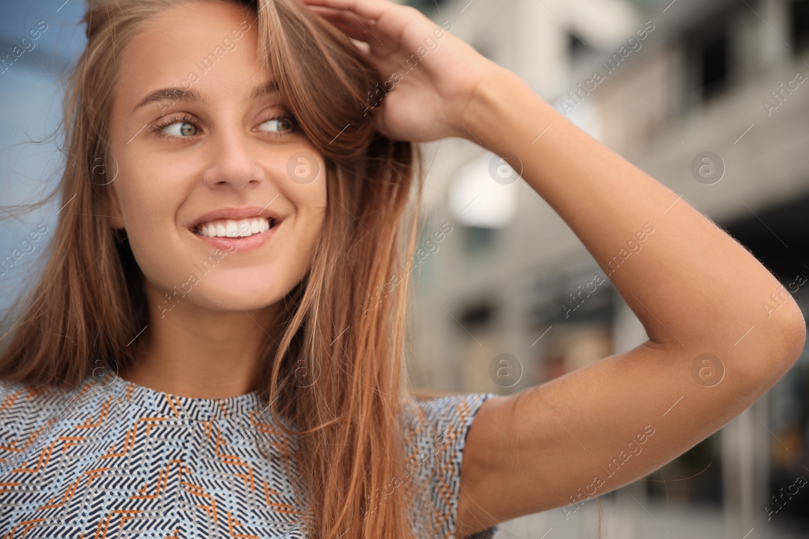 Photo of Portrait of beautiful young woman outdoors, closeup