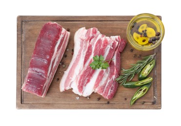 Photo of Pieces of raw pork belly, chili pepper, peppercorns, rosemary and parsley isolated on white, top view