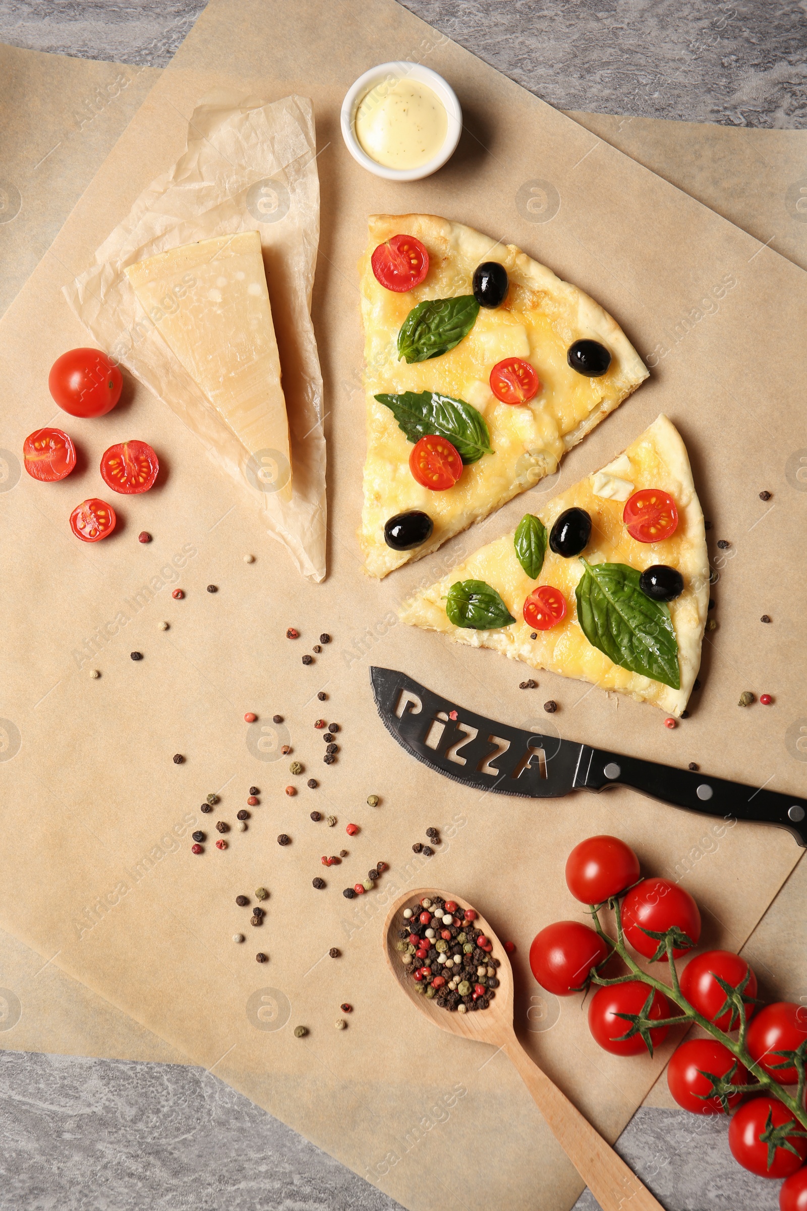 Photo of Flat lay composition with slices of tasty homemade pizza on table