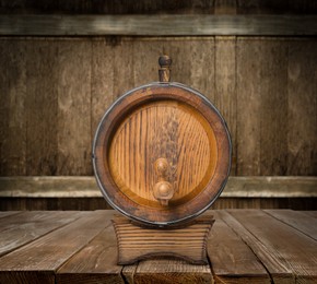 Image of One wooden barrel on rack in cellar