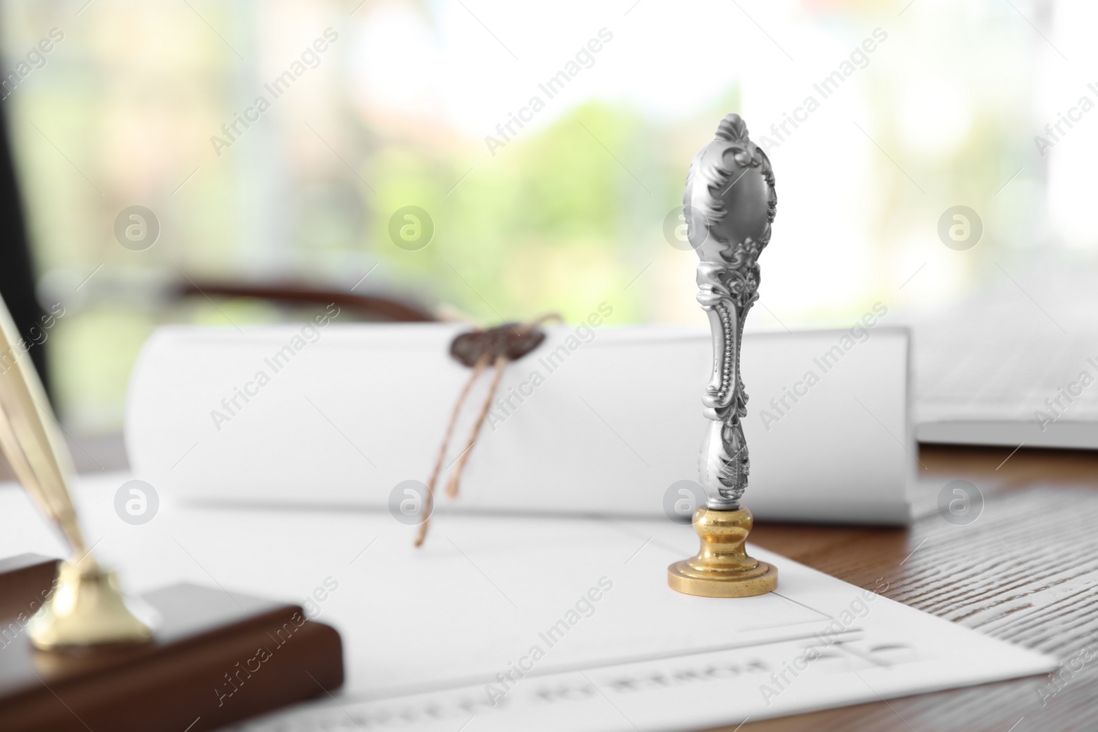 Photo of Vintage notary stamp and documents on desk with space for text, closeup