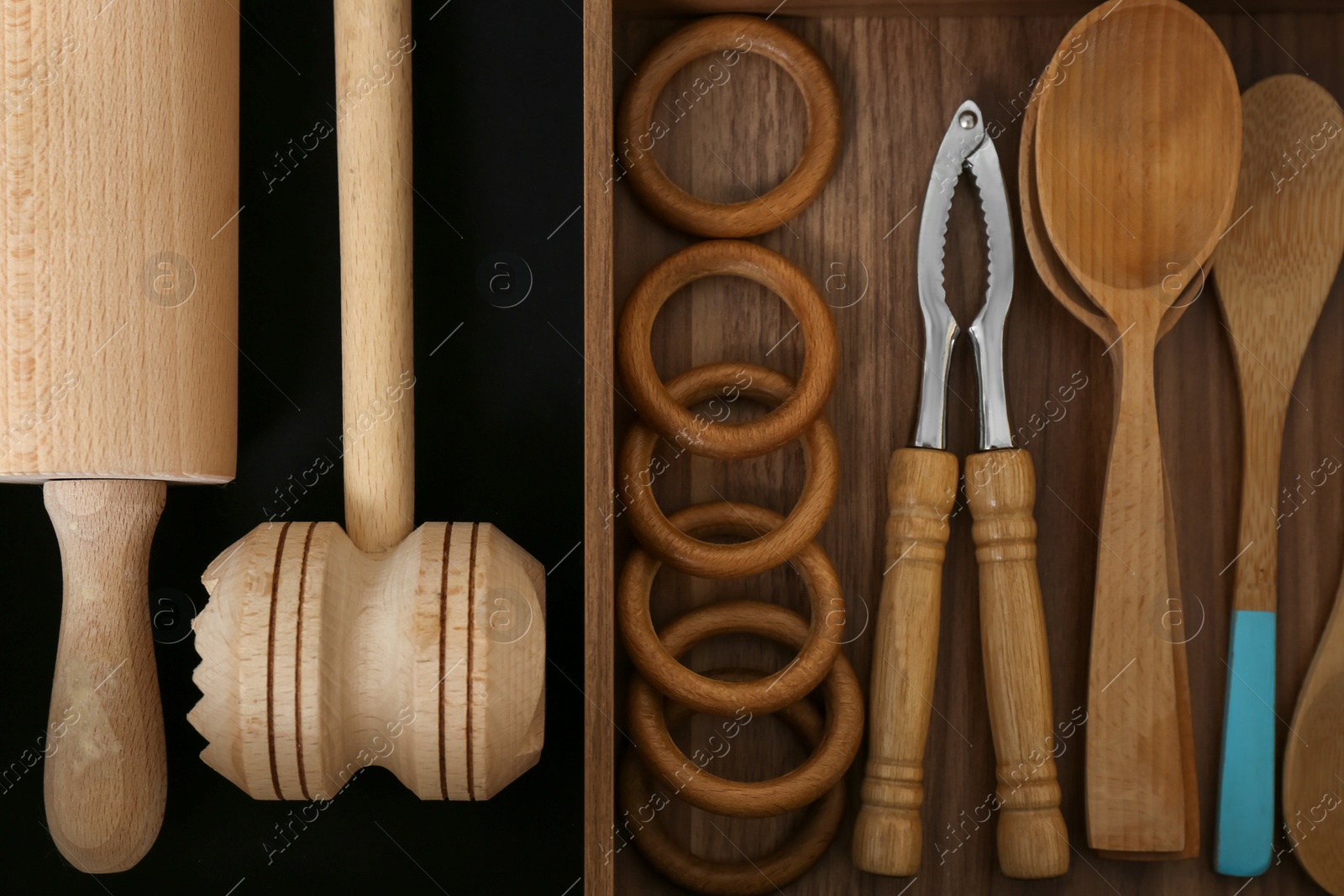 Photo of Drawer with utensil set, top view. Order in kitchen