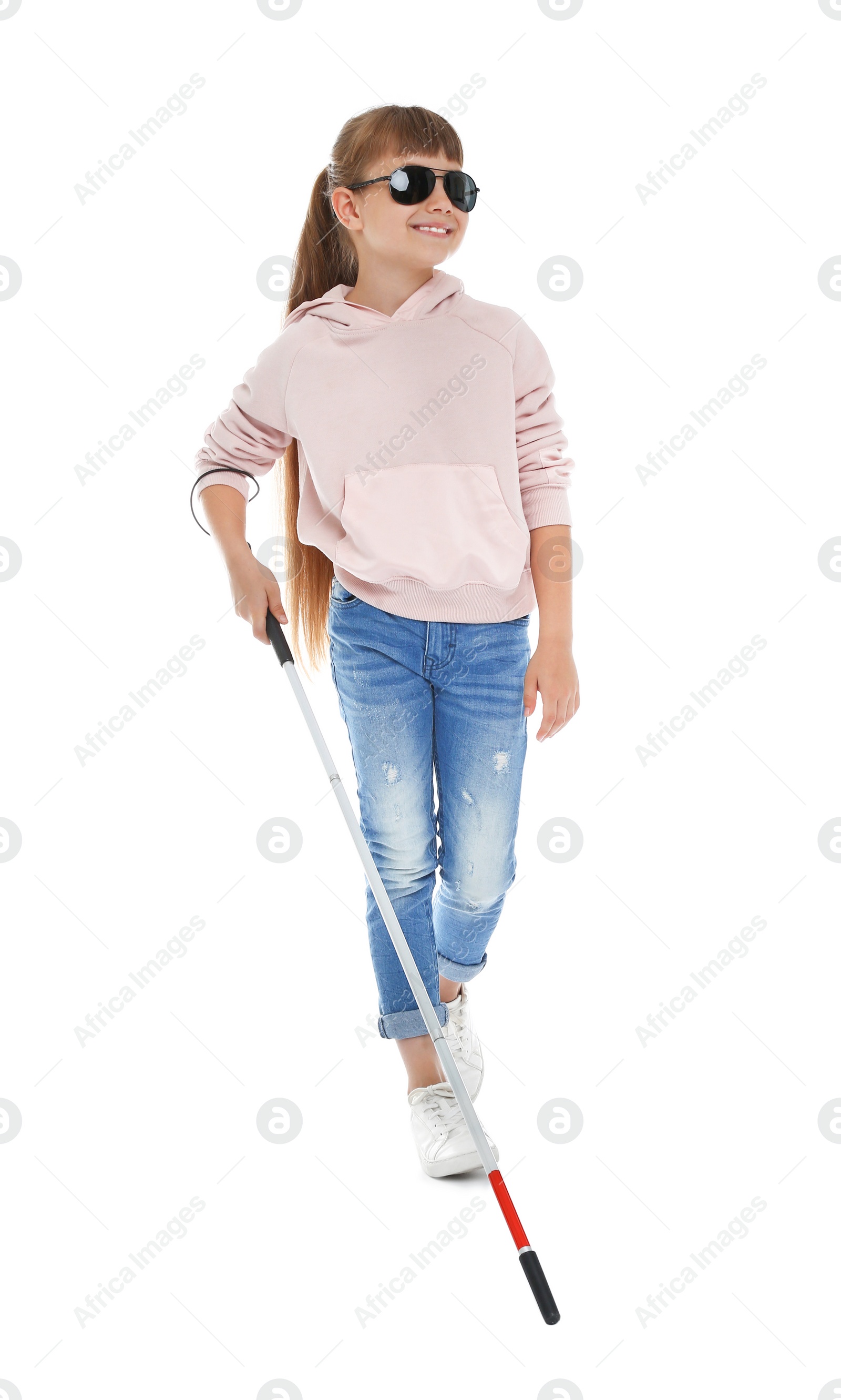 Photo of Blind girl with long cane walking on white background