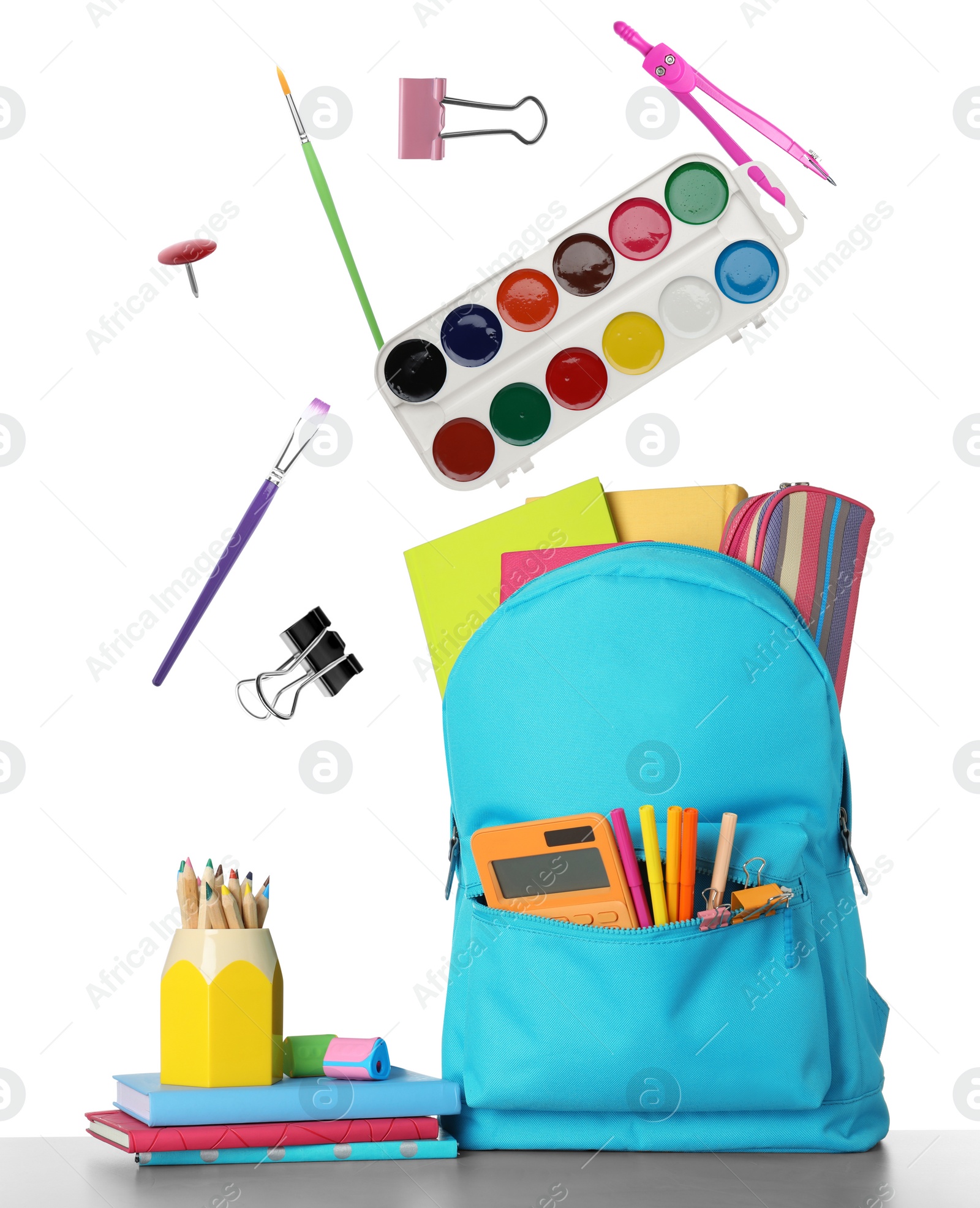 Image of School stationery flying over backpack on white background