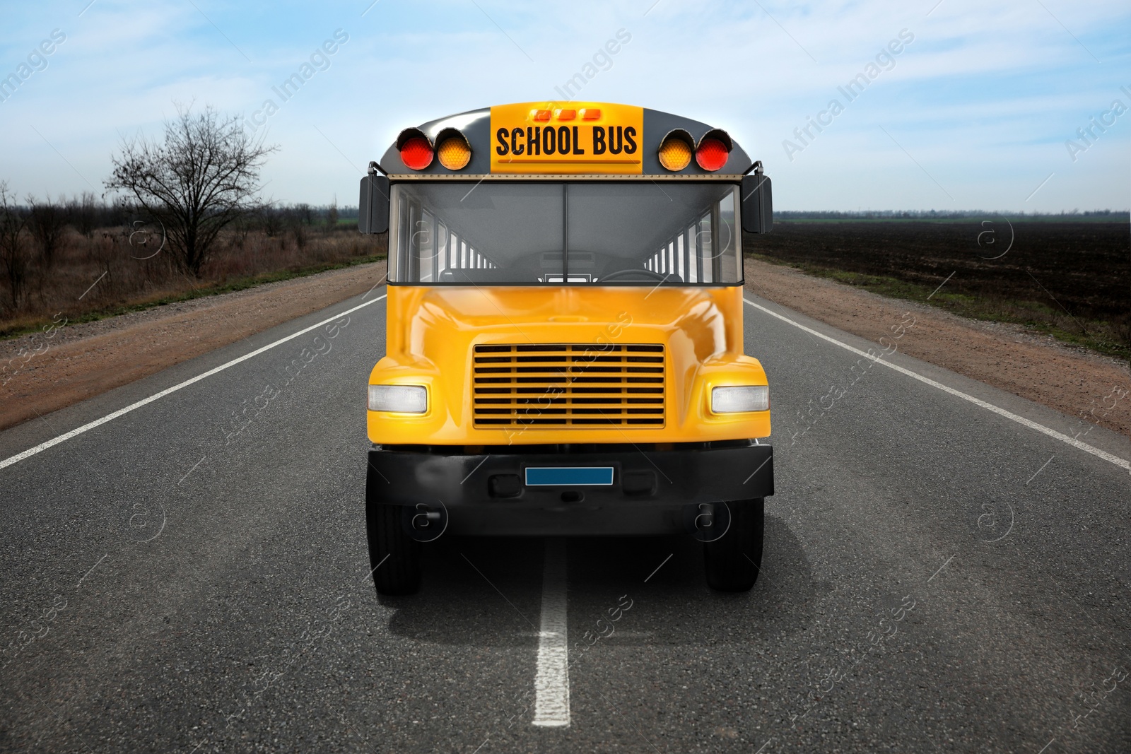 Image of Yellow school bus on road outdoors. Transport for students