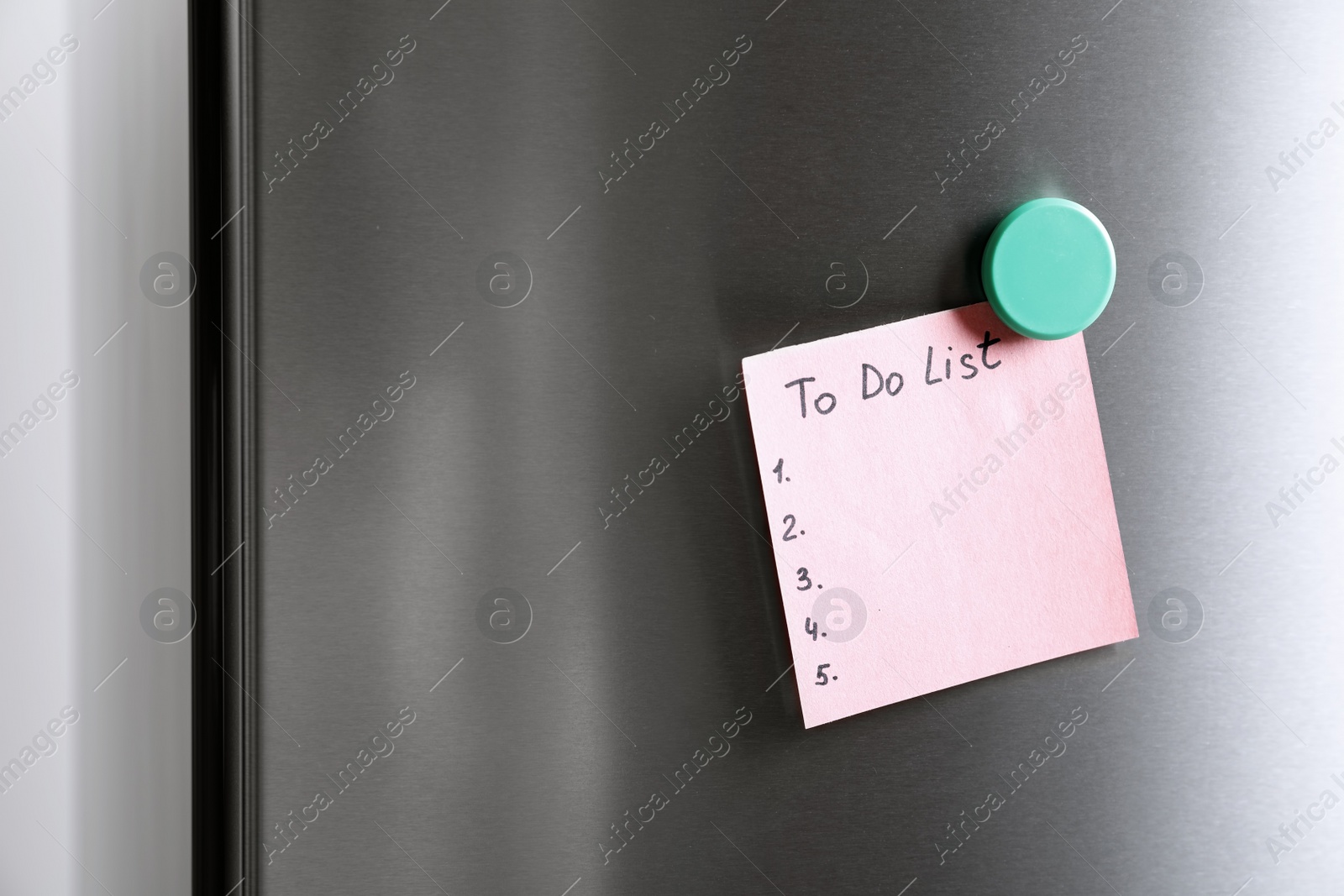 Photo of Note with words TO DO LIST on refrigerator door. Space for text