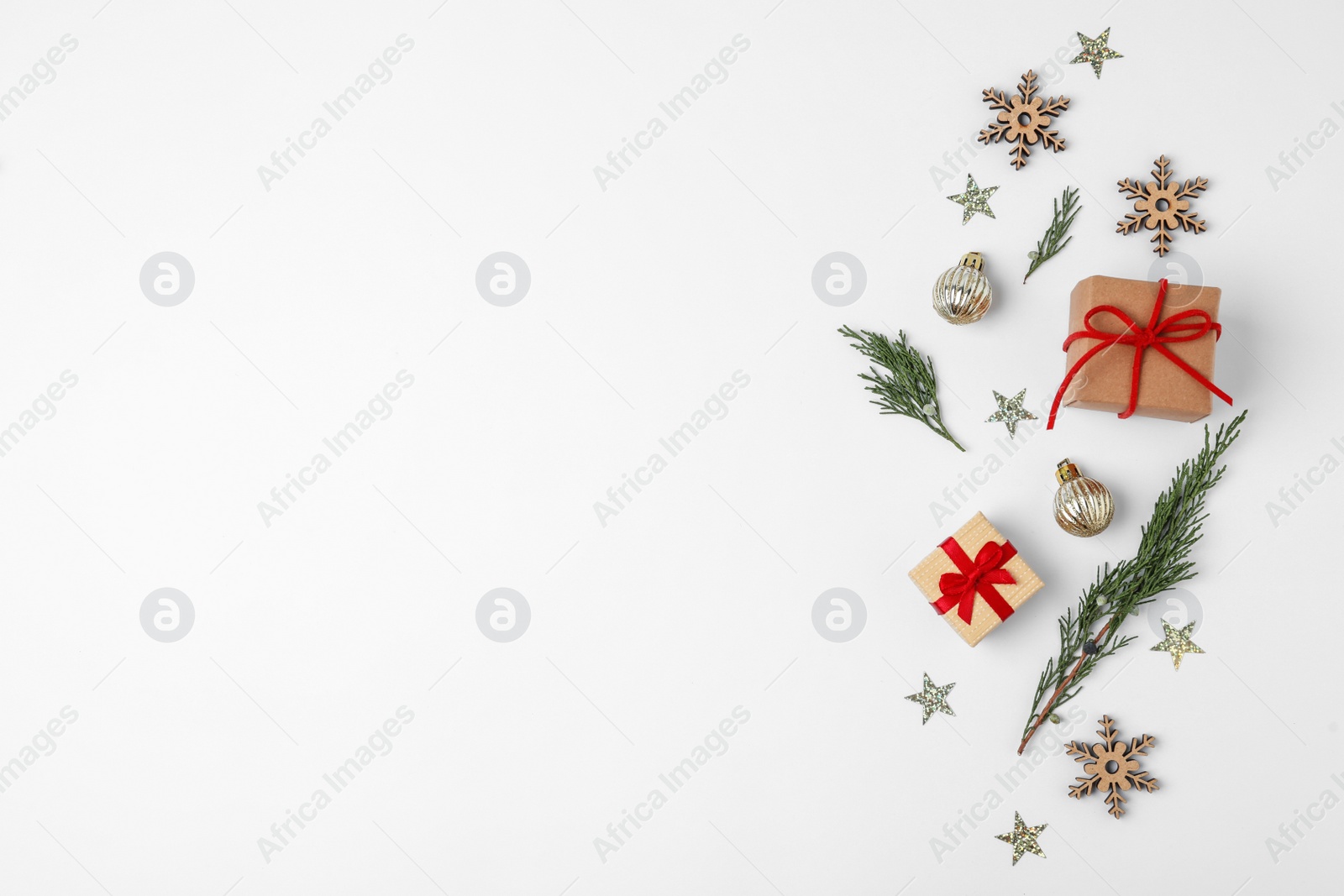 Photo of Winter composition with fir tree and gift boxes on white background, top view