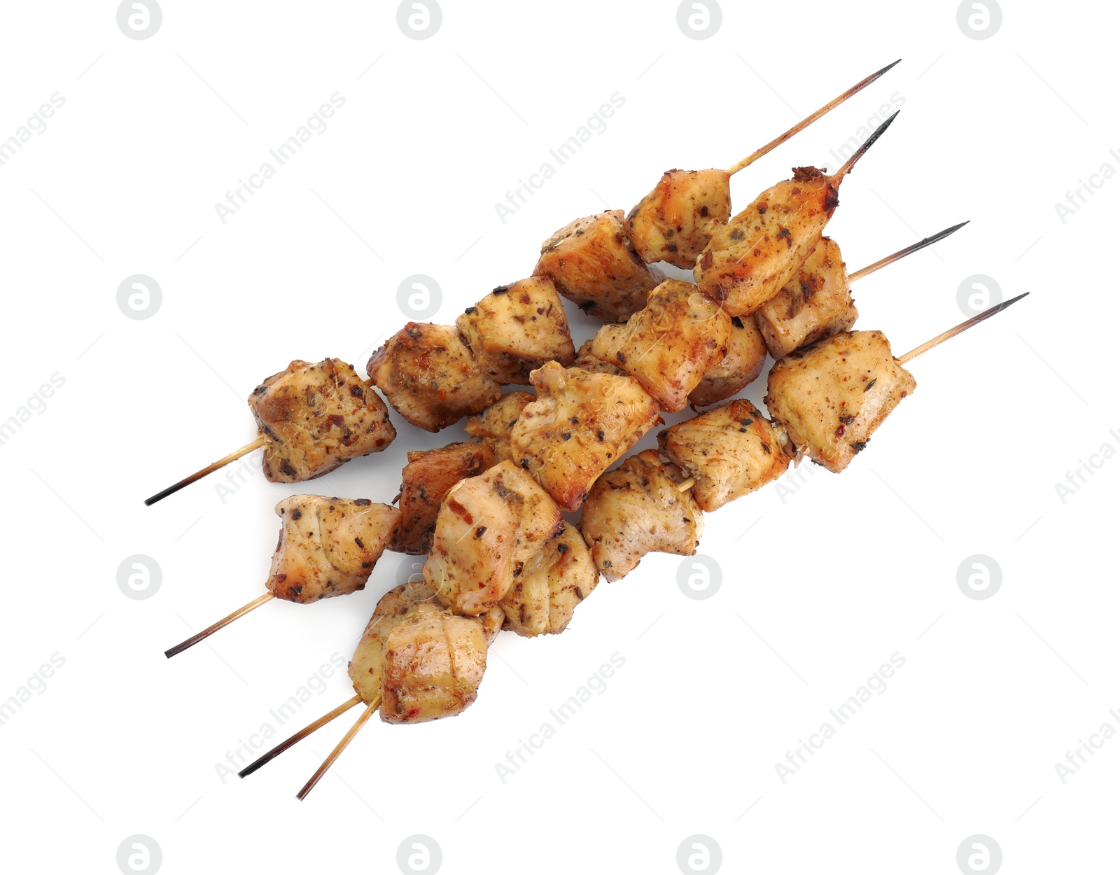 Photo of Delicious fresh shish kebabs isolated on white, top view