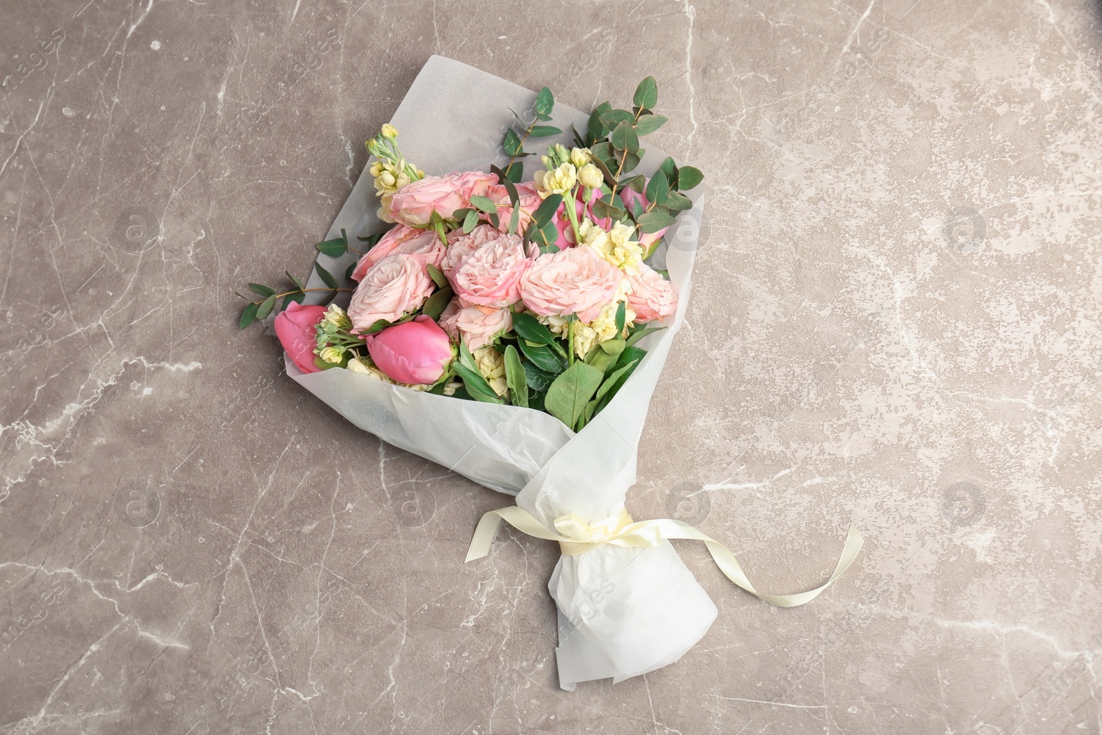 Photo of Bouquet of beautiful fragrant flowers on table