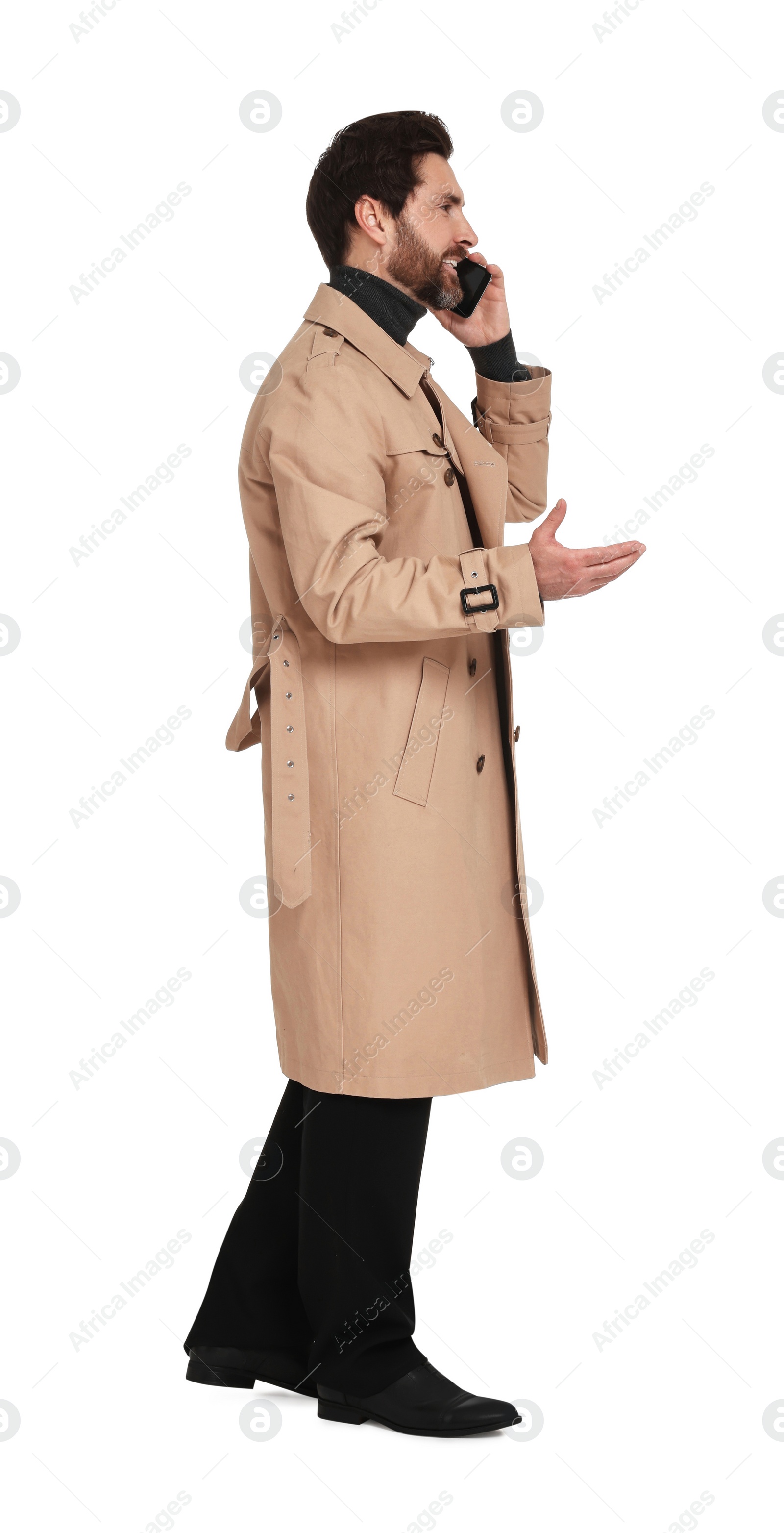 Photo of Handsome man talking on phone against white background