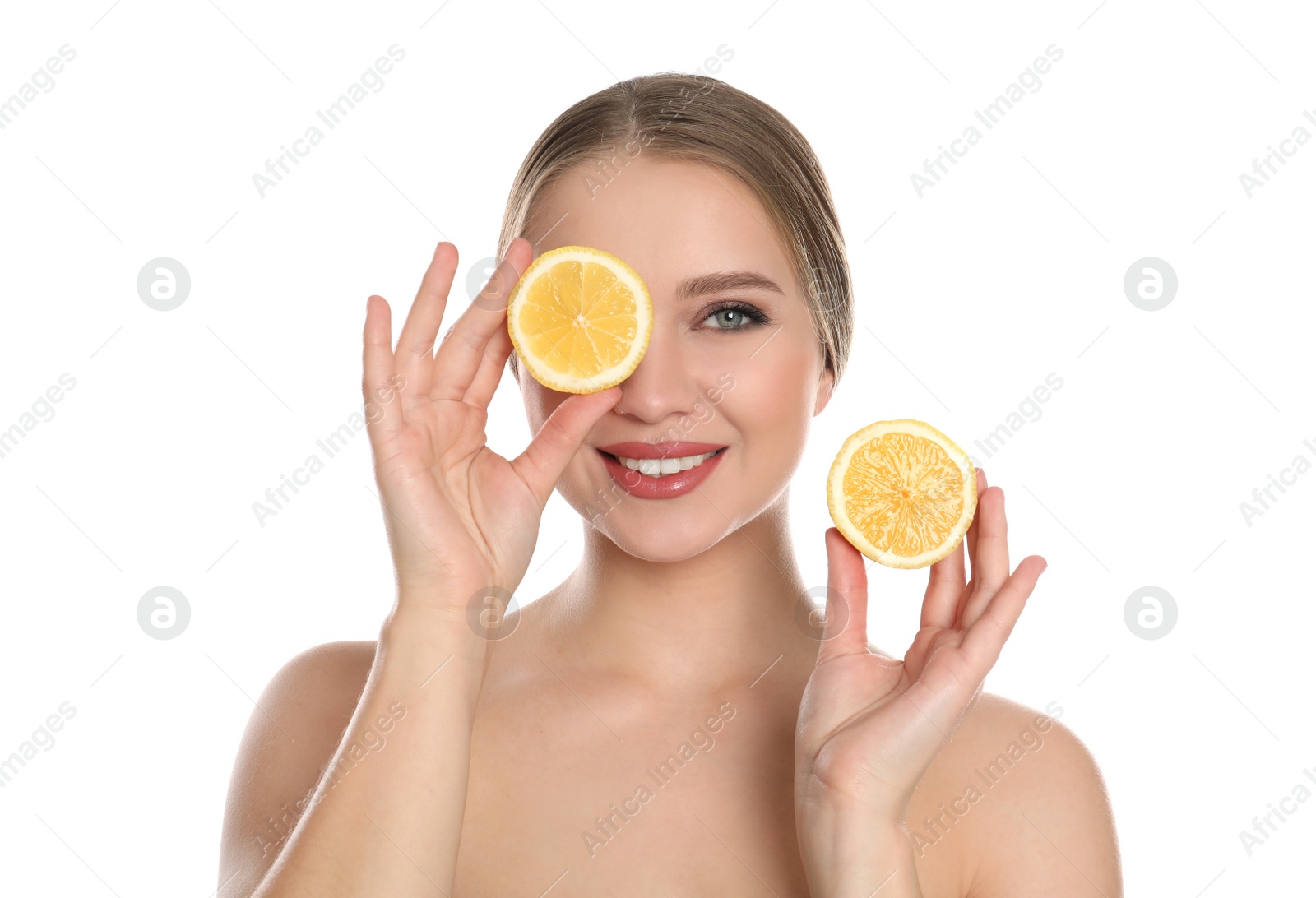 Photo of Young woman with cut lemon on white background. Vitamin rich food