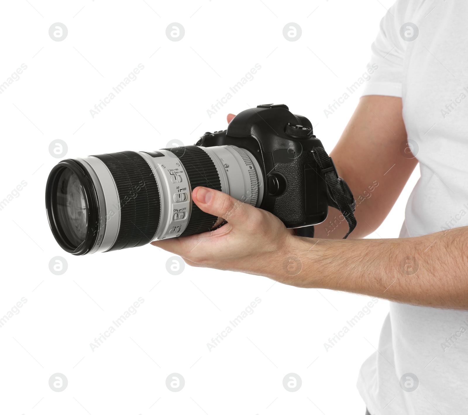 Photo of Photographer holding modern camera on white background, closeup