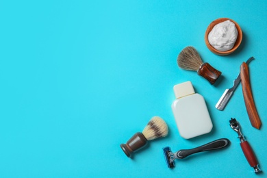 Flat lay composition with shaving accessories for men on color background. Space for text