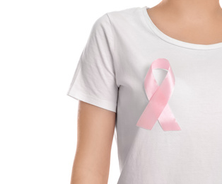 Woman with pink ribbon on white background, closeup. Breast cancer awareness