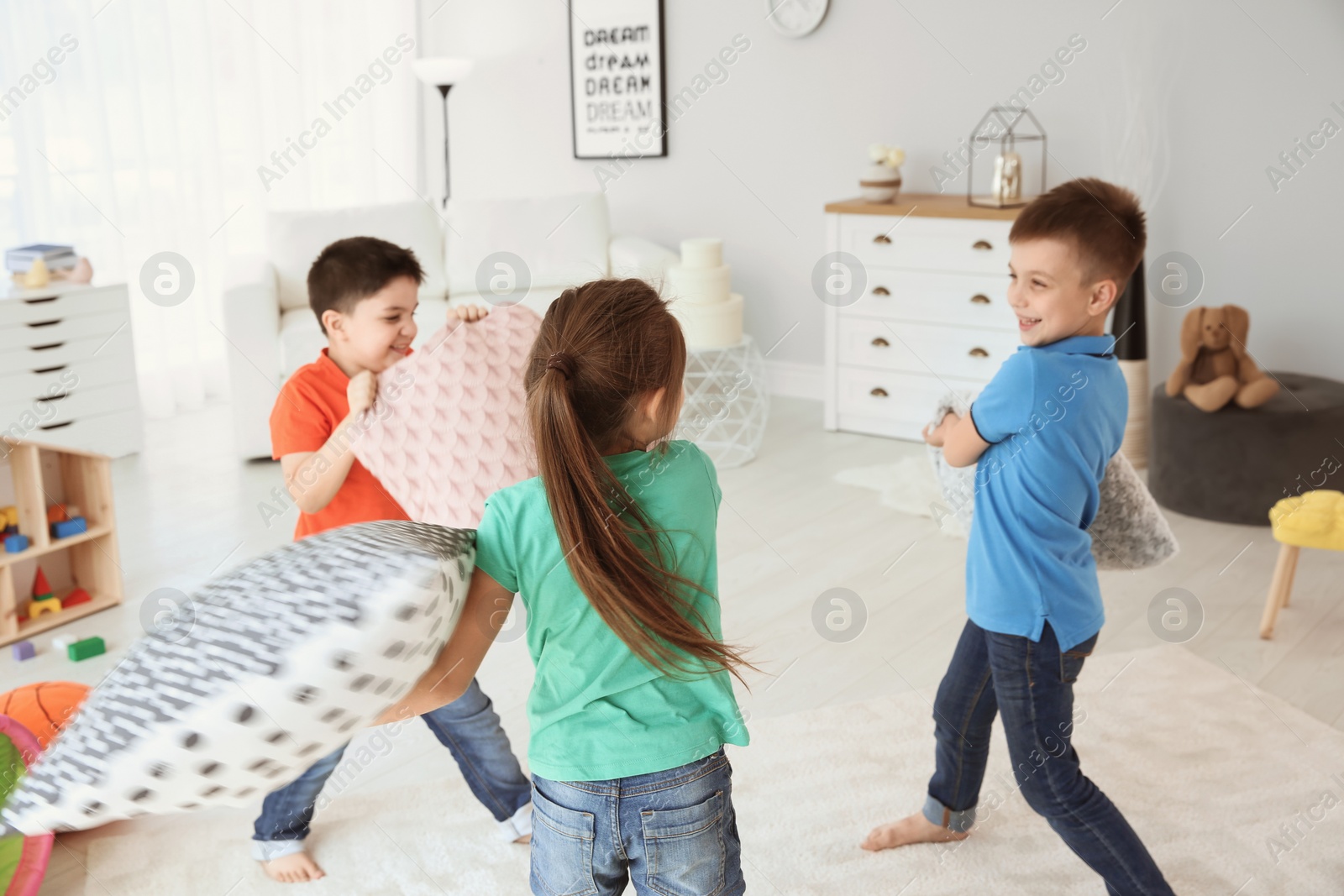 Photo of Cute little children playing together, indoors