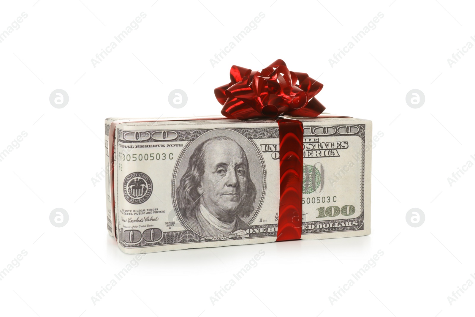 Photo of Gift box wrapped in decorative paper with dollar pattern on white background