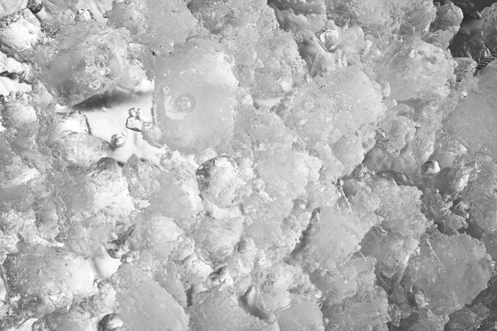 Photo of Crushed ice melting as background, top view