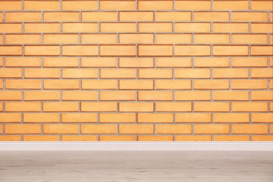 Image of Room with brick wall and wooden floor