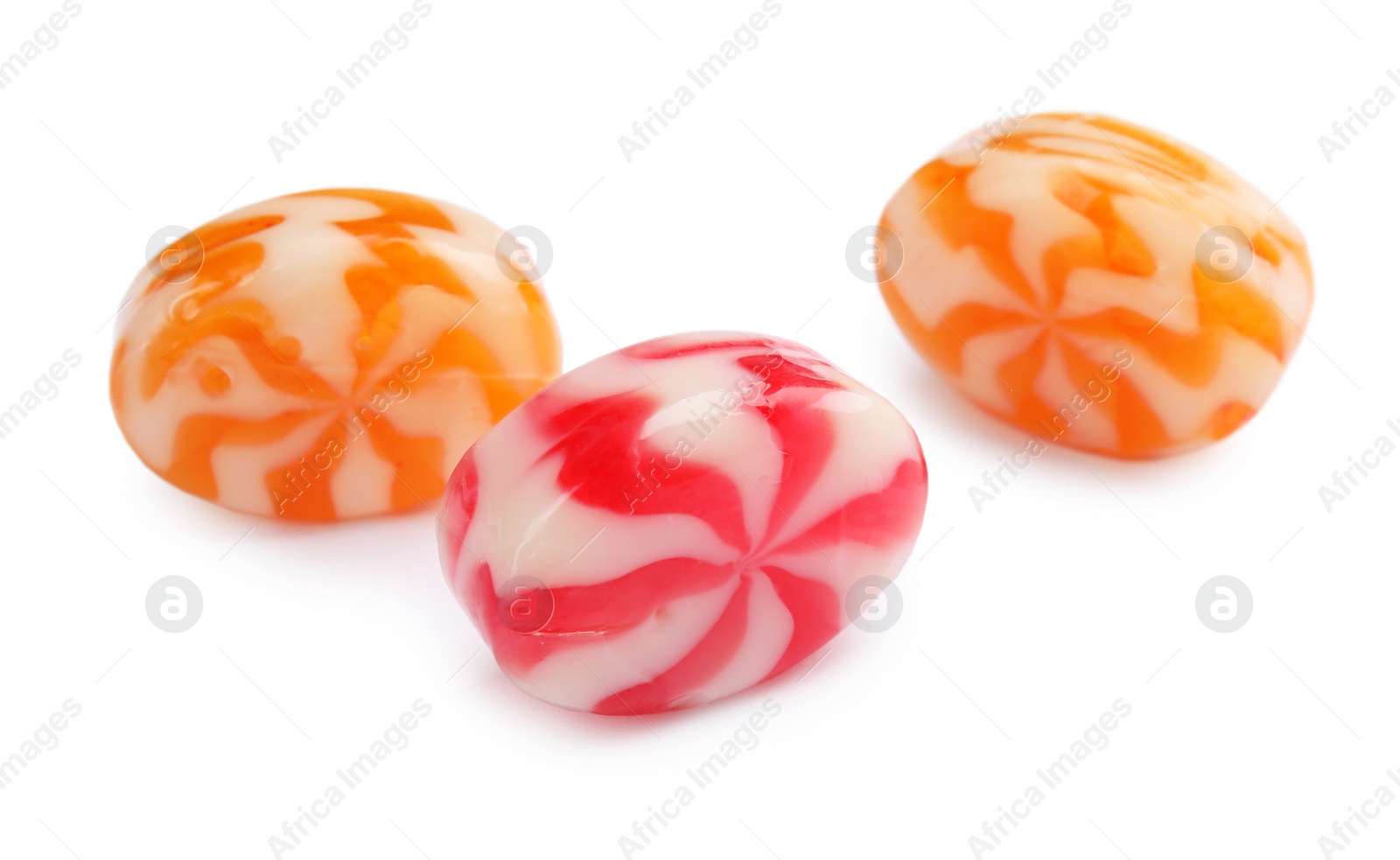 Photo of Different delicious colorful candies on white background