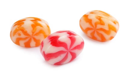 Different delicious colorful candies on white background