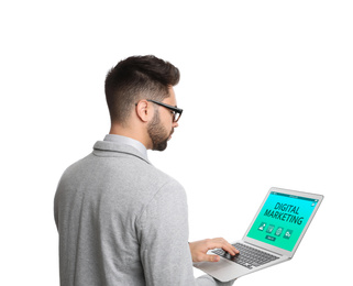 Digital marketing concept. Young man with laptop on white background