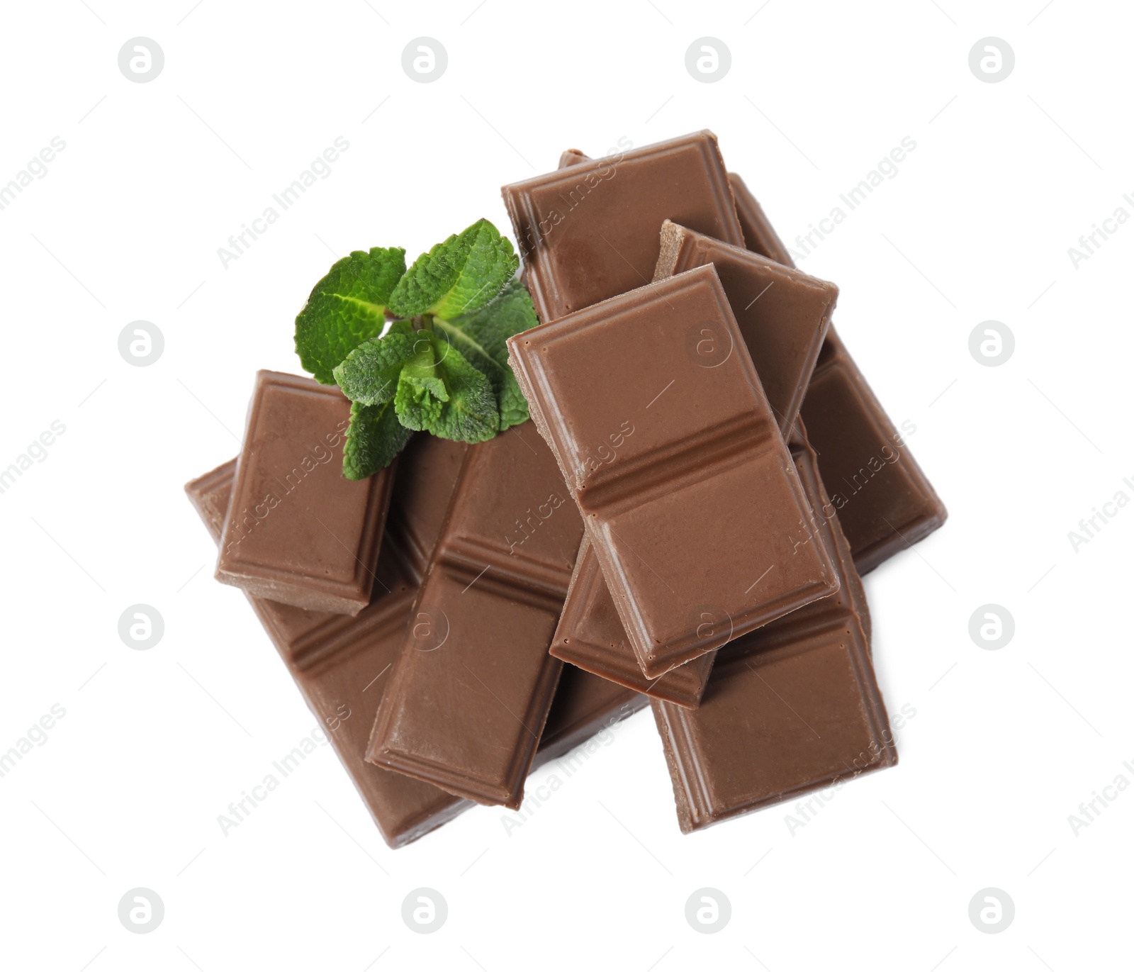 Photo of Tasty chocolate pieces and mint on white background, top view