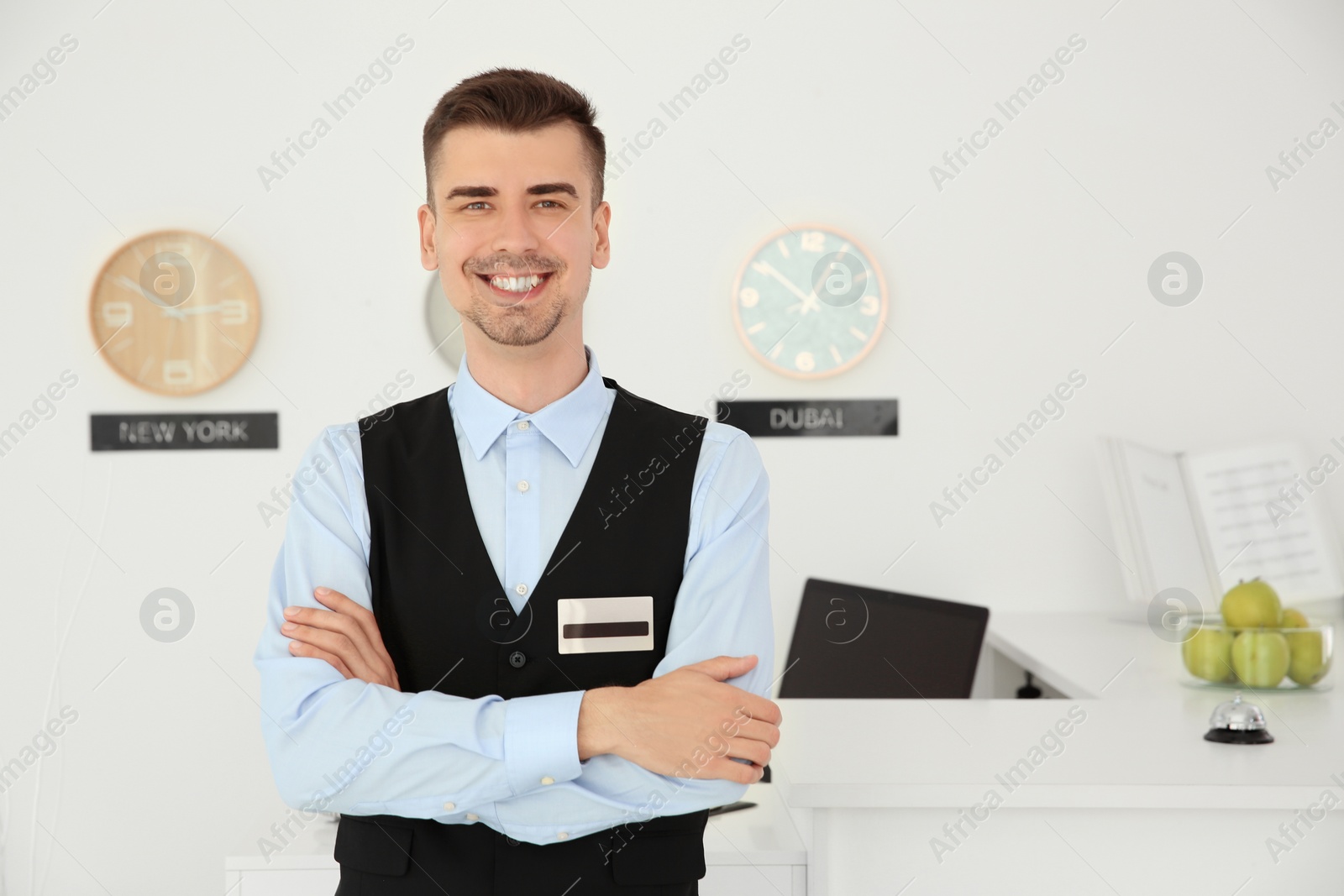 Photo of Portrait of male receptionist at workplace in hotel