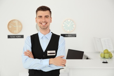 Portrait of male receptionist at workplace in hotel