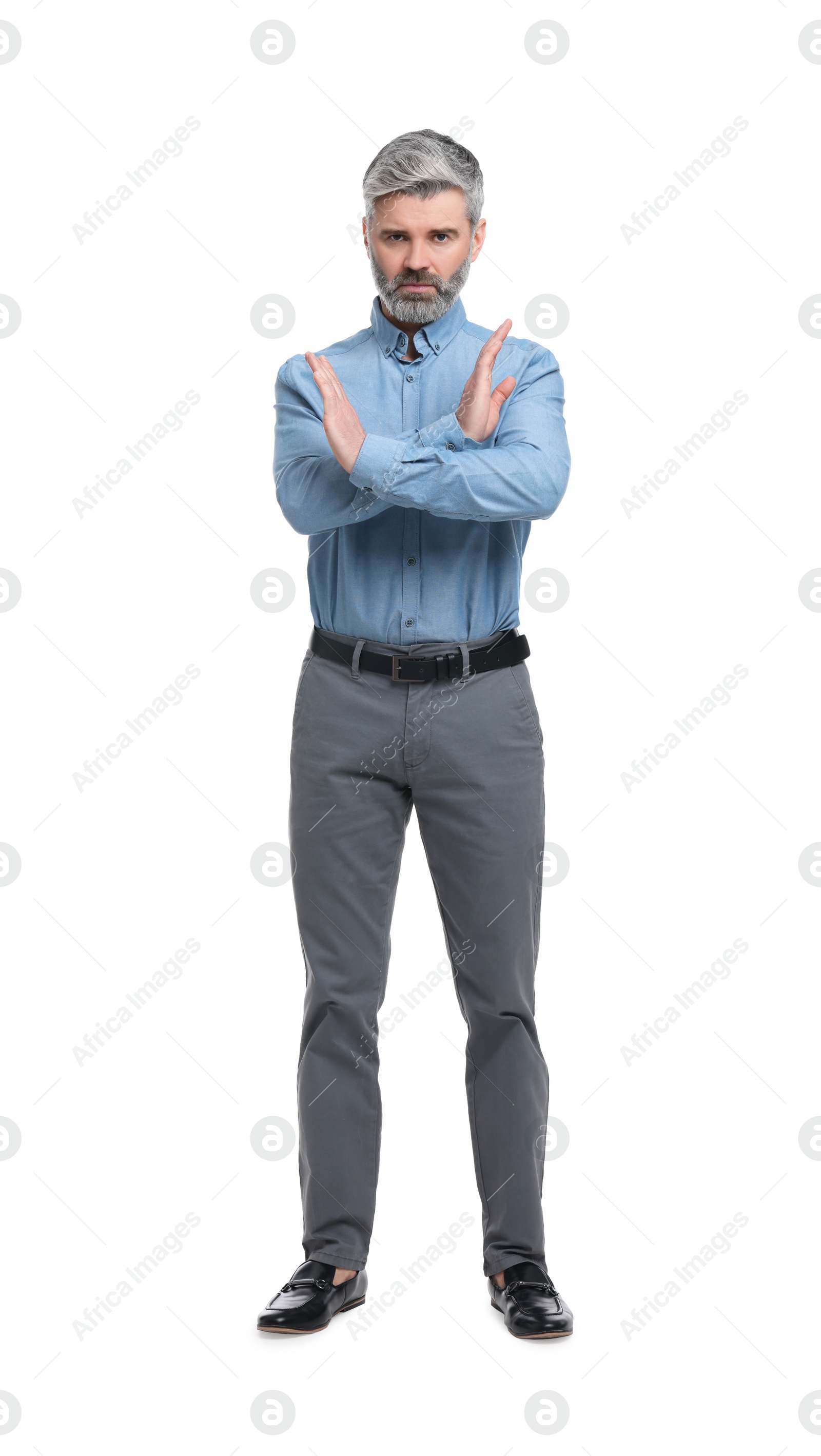 Photo of Mature businessman in stylish clothes posing on white background