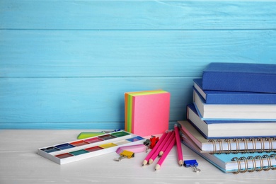 Photo of Different stationery on wooden table. Back to school