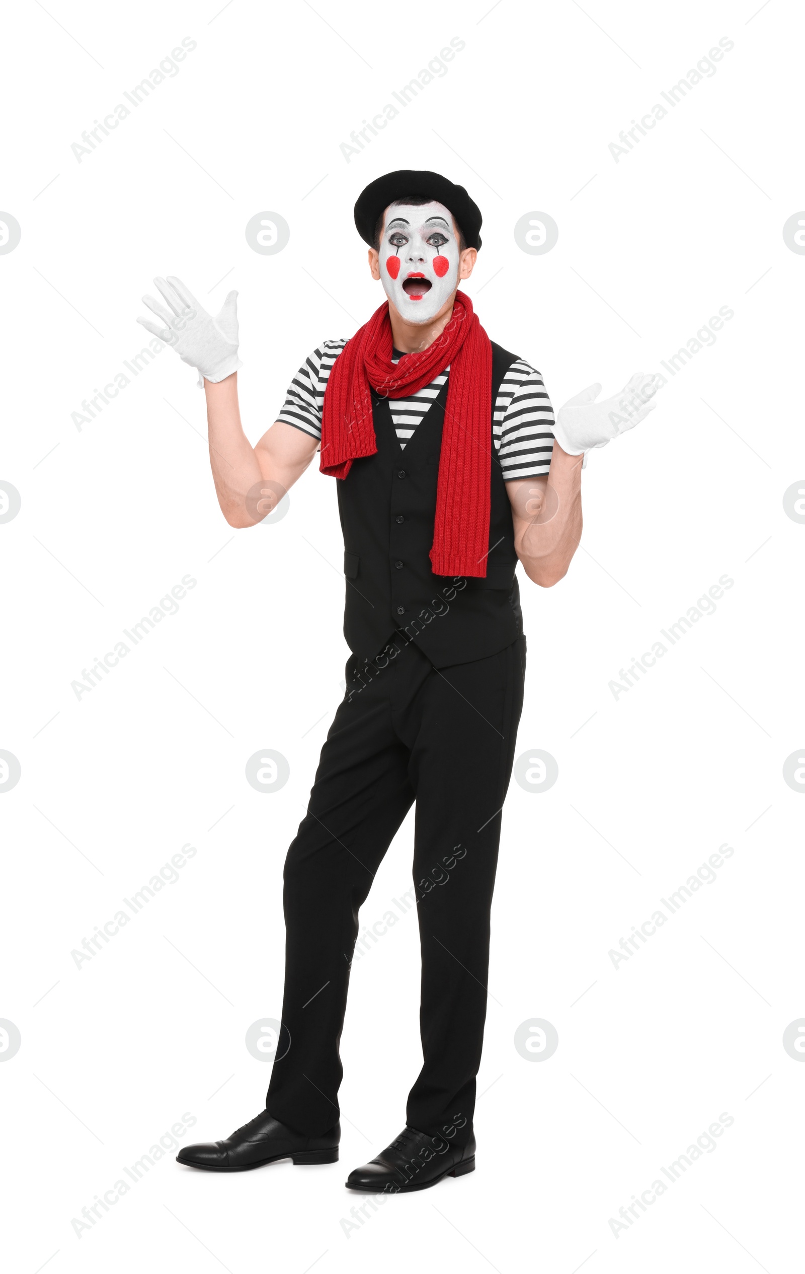 Photo of Funny mime artist in beret posing on white background