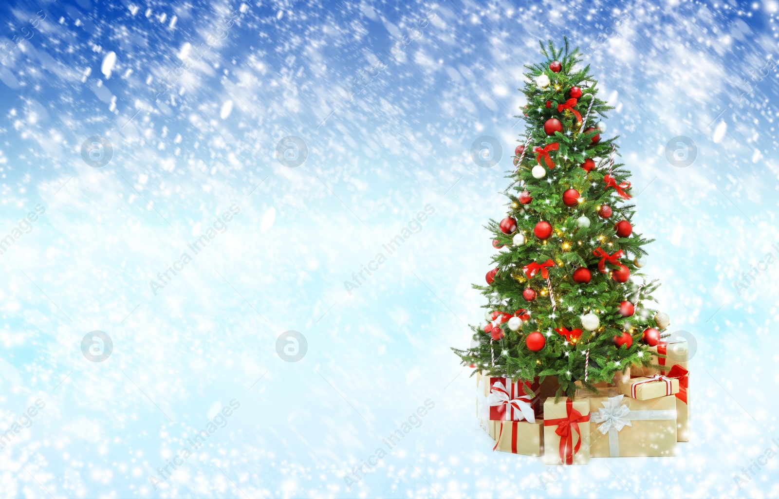 Image of Beautiful decorated Christmas tree on light blue background, space for text. Bokeh effect