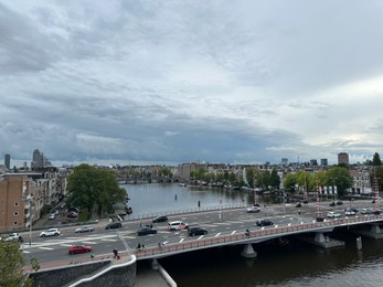 Photo of Amterdam, Netherlands - September 22, 2023: Beautiful view on city under cloudy sky