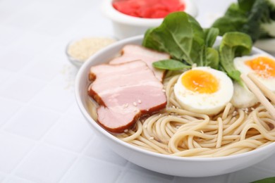 Photo of Delicious ramen with meat on white table, closeup with space for text. Noodle soup