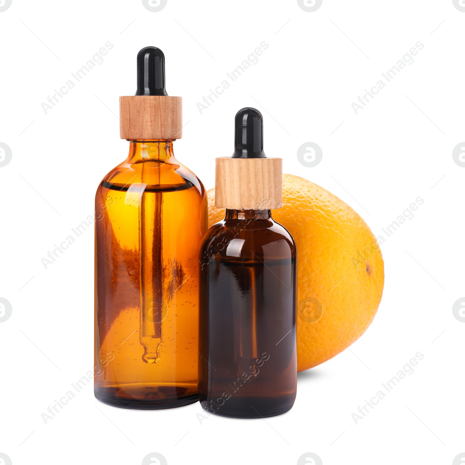 Photo of Bottles of citrus essential oil and fresh orange isolated on white