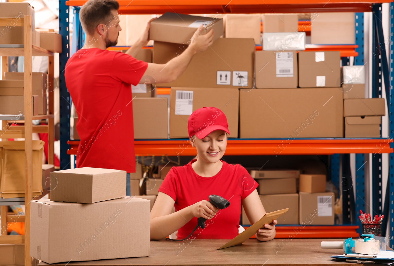 Photo of Man and woman working at post office