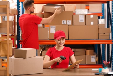 Photo of Man and woman working at post office