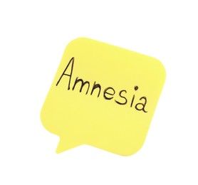 Yellow sticky note with word Amnesia on white background