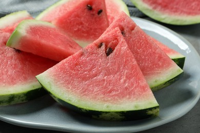 Photo of Delicious fresh watermelon slices on plate, closeup