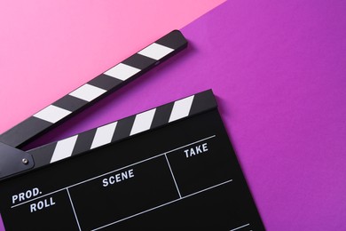 Clapperboard on color background, top view. Film industry